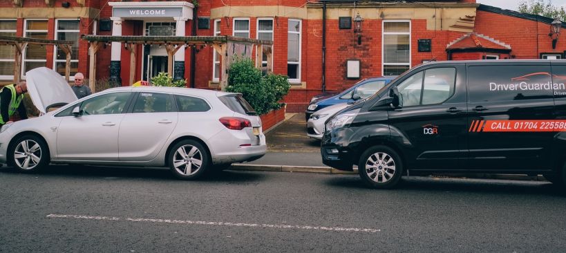 A Driver Guardian Member receiving Assistance with a Taxi